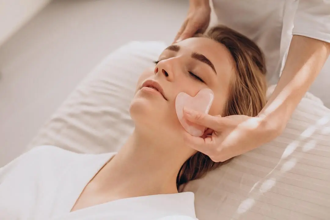 Chilled cold-stone Gua Sha facial massage routine for summer skin hydration, serving local clients across Potomac, Rockville, Bethesda and Washington DC.